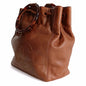 Chanel bucket style handbag with drawstring in leather and bone